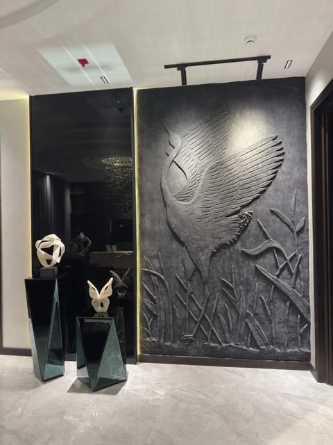 Entrance hallway with sculpted crane wall art