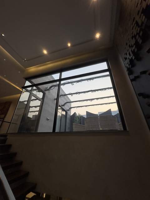 Stairwell with courtyard-facing glass wall