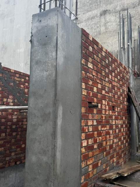 RCC column tied into brick wall